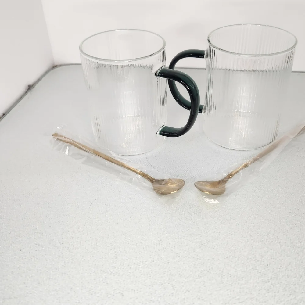 Lot 2 heat resistant clear and green‎ glass coffee/tea cups w gold stir spoons